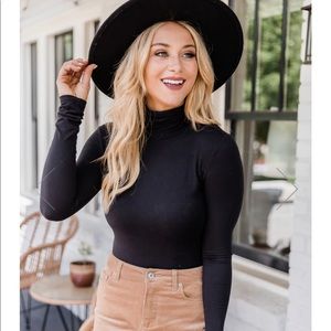 Pink Lily Women’s Black turtle neck long sleeved bodysuit